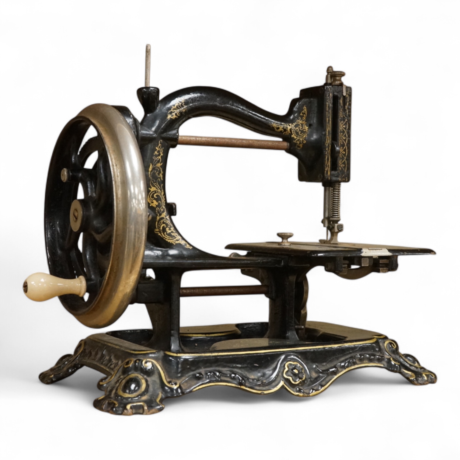 A late 19th century Wanzer sewing machine, in black enamel with gilt decoration.